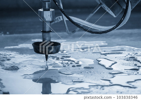 Close-up scene of multi-axis abrasive waterjet cutting machine cutting the aluminum plate. 103838346