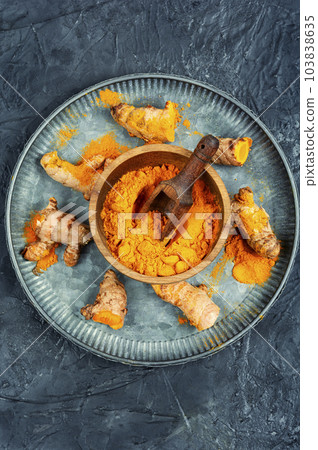 Turmeric root and turmeric powder. Turmeric root and turmeric powder. 103838635