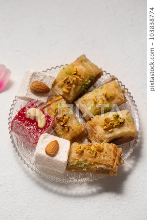 Oriental sweets, baklava and Turkish delight on a plate Oriental sweets, baklava and Turkish delight on a plate 103838774