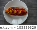 Standard hot dog with mustard and ketchup 103839329