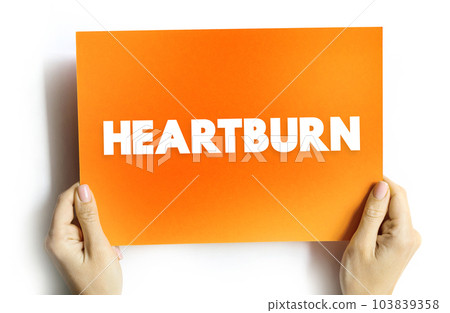 Heartburn is a burning feeling in the chest caused by stomach acid travelling up towards the throat, text concept on card Heartburn is a burning feeling in the chest caused by stomach acid travelling up towards the throat, text concept on card 103839358
