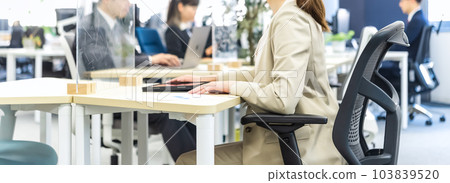 Image cut of a business woman working in a free address office 103839520