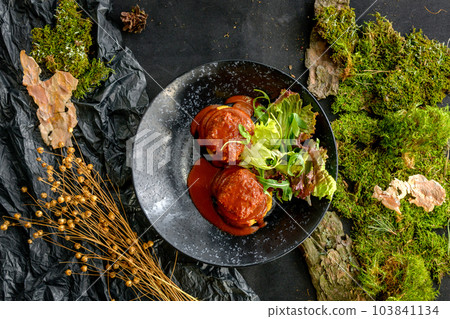 Meat balls with tomato sauce, lettuce and arugula Meat balls with tomato sauce, lettuce and arugula 103841134