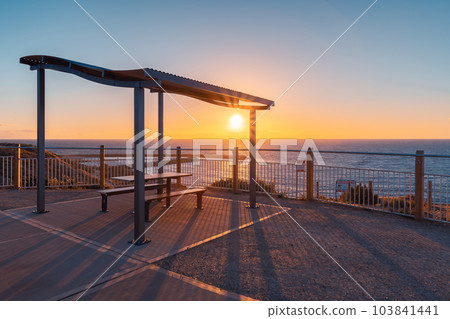 Outdoor picnic table on the beach  at sunset 103841441