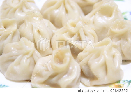 Xiao long bao served on a plate 103842292