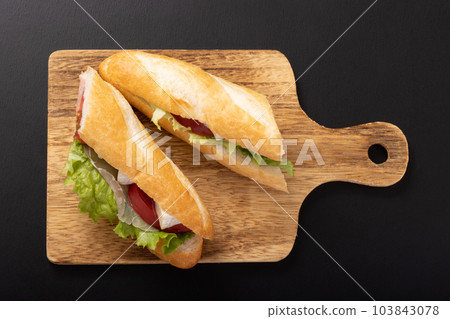Sandwich with uncured ham and camembert cheese 103843078