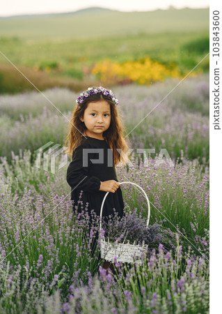 Provence child relaxing in lavender field. Little lady in a black dress. Girl with bag. Provence child relaxing in lavender field. Little lady in a black dress. Girl with bag. 103843600