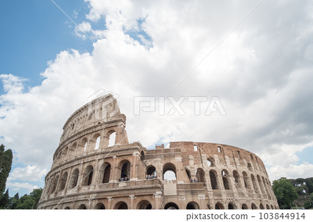 The Colosseum, an oval amphitheatre in the center of the city of Rome, Italy. It is the famous landmark built of concrete and sand. 103844914