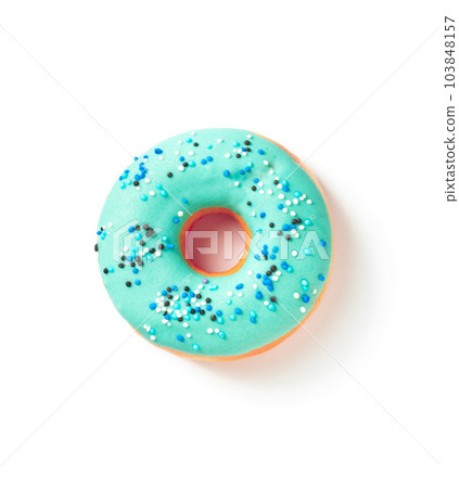 Sweet donut in colored blue glaze on a white background top view 103848157