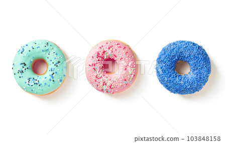 Three different color donuts top view on white background Three different color donuts top view on white background 103848158