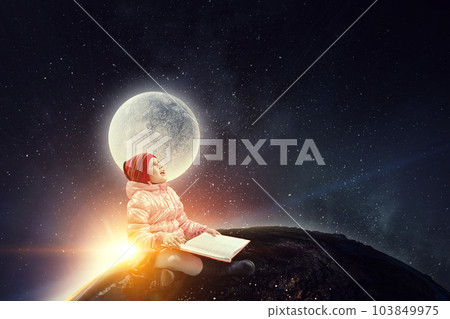 Little girl reading a book 103849975