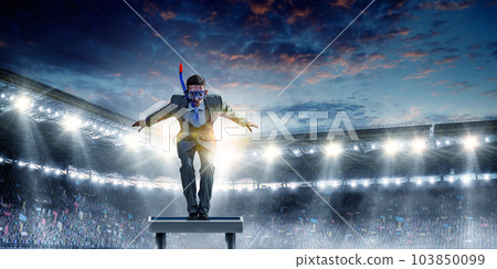 Young businessman in suit ready to dive 103850099
