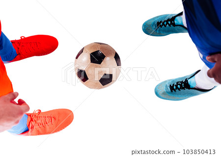 Football player plays with soccerball in a match Football player plays with soccerball in a match 103850413