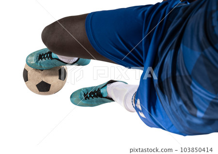 Football player plays with soccerball in a match 103850414