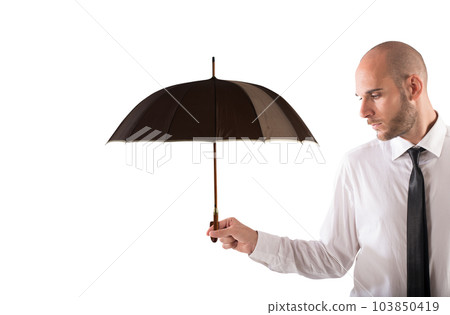 Businessman holds an umbrella. Concept of help and insurance Businessman holds an umbrella. Concept of help and insurance 103850419