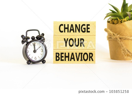 Motivation and Change your behavior symbol. Concept words Change your behavior on wooden block on a beautiful white table white background. Business change your behavior concept. Copy space. 103851258