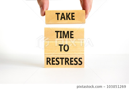 Take time to restress symbol. Concept words Take time to restress on wooden blocks. Beautiful white table white background. Psychological business and take time to restress concept. Copy space. 103851269