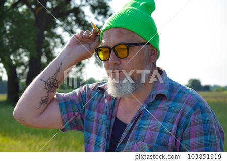 Portrait painter stylish look going to draw pencil outdoors at dawn Portrait painter stylish look going to draw pencil outdoors at dawn 103851919