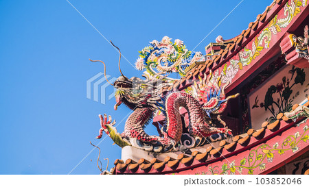 Chinese dragon on the roof of chinese temple.the eaves of a temple in China Dragons on the roof of Heaven Worshiping Palace . Chinese imperial roof decorations Chinese dragon on the roof of chinese temple.the eaves of a temple in China Dragons on the roof of Heaven Worshiping Palace . Chinese imperial roof decorations 103852046