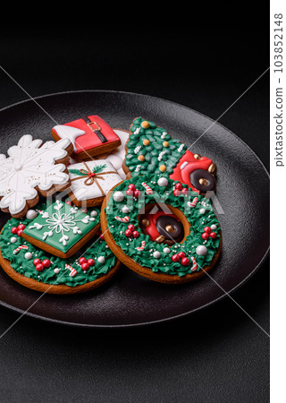 Delicious fresh colorful Christmas or New Year gingerbread cookies 103852148