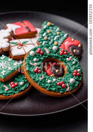 Delicious fresh colorful Christmas or New Year gingerbread cookies 103852150