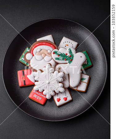 Delicious fresh colorful Christmas or New Year gingerbread cookies 103852159