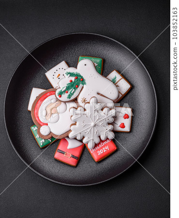 Delicious fresh colorful Christmas or New Year gingerbread cookies 103852163