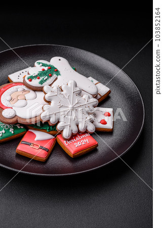 Delicious fresh colorful Christmas or New Year gingerbread cookies 103852164