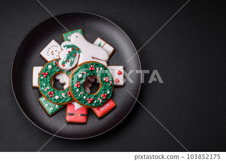Delicious fresh colorful Christmas or New Year gingerbread cookies 103852175
