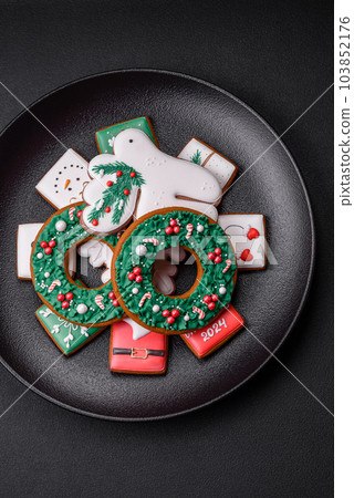 Delicious fresh colorful Christmas or New Year gingerbread cookies 103852176