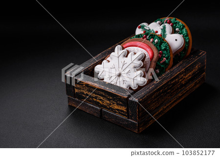 Delicious fresh colorful Christmas or New Year gingerbread cookies 103852177