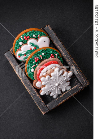 Delicious fresh colorful Christmas or New Year gingerbread cookies 103852189