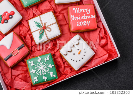 Delicious fresh colorful Christmas or New Year gingerbread cookies Delicious fresh colorful Christmas or New Year gingerbread cookies 103852203