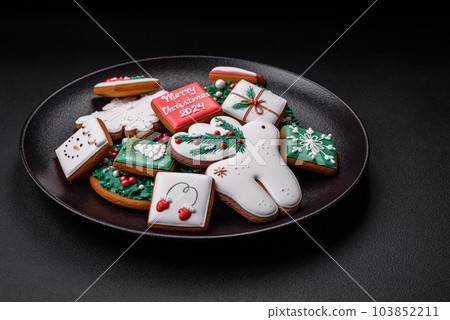 Delicious fresh colorful Christmas or New Year gingerbread cookies 103852211