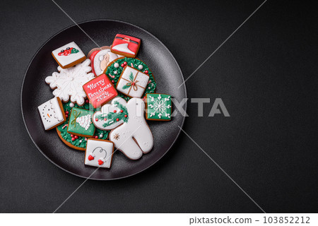 Delicious fresh colorful Christmas or New Year gingerbread cookies 103852212