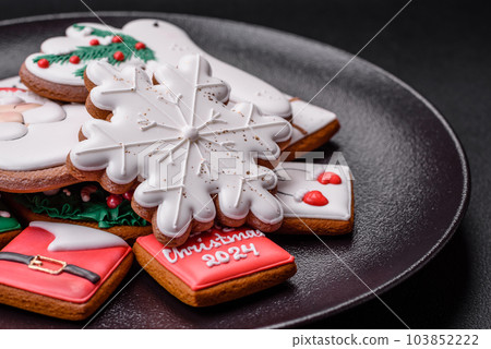 Delicious fresh colorful Christmas or New Year gingerbread cookies Delicious fresh colorful Christmas or New Year gingerbread cookies 103852222
