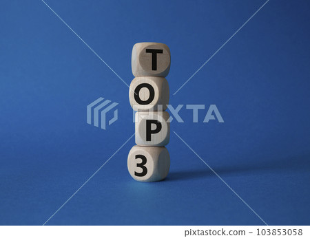 Top 3 symbol. Concept word Top 3 on wooden cubes. Beautiful blue background. Business and Top 3 concept. Copy space. 103853058