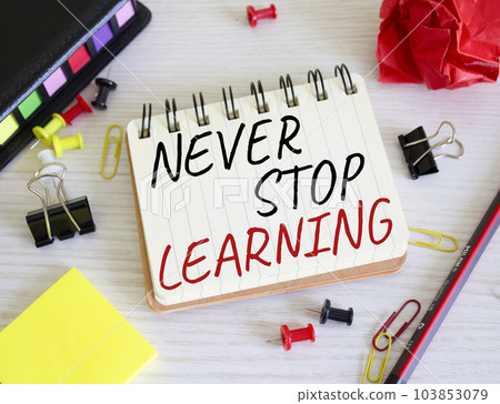Never stop learning symbol. Concept words Never stop learning on wooden notebook. Beautiful wooden background. Business and Never stop learning concept. Copy space. 103853079