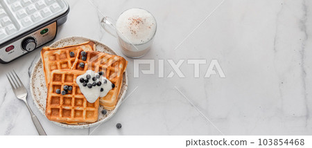 Breakfast belgian waffles, waffle maker. Copy space Breakfast belgian waffles, waffle maker. Copy space 103854468