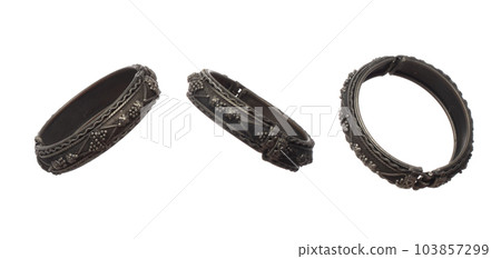 Fashion Silver bangle bracelet with beautiful work detail is value. Luxury silver metal bangle bracelet is fashion trend and fly in air. White background isolated 103857299