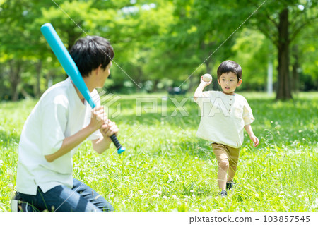 Parents playing balls in the park Parents playing balls in the park 103857545