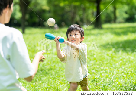 Parents playing balls in the park 103857558