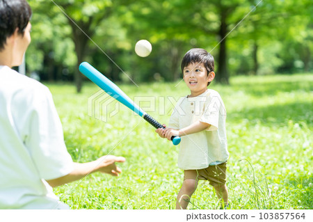 Parents playing balls in the park Parents playing balls in the park 103857564