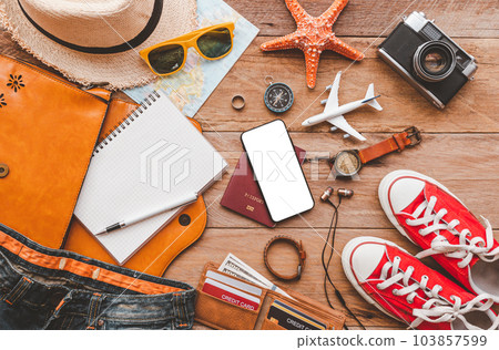 Travel accessories costumes. The cost of travel maps prepared for the trip.travel planning concept. 103857599