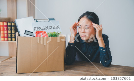 Female company employee stressed and fed up after quitting her job to look for a new job, fired or was fired by the employer Female company employee stressed and fed up after quitting her job to look for a new job, fired or was fired by the employer 103857601