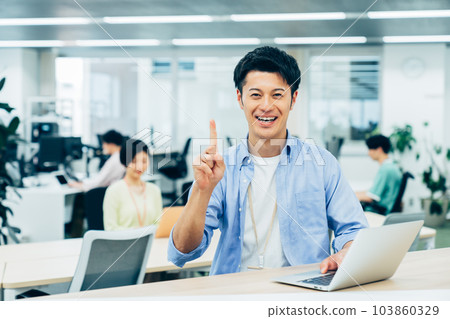 Middle-class engineer working in an office 103860329