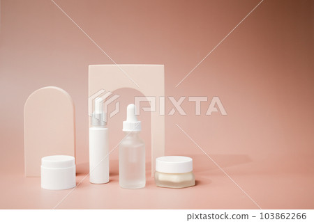 beauty product and mock-up skincare container on a pastel display background. beauty product and mock-up skincare container on a pastel display background. 103862266
