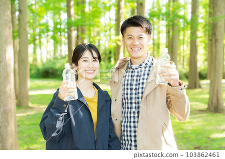 Photo of men and women with plastic bottles Photo of men and women with plastic bottles 103862461
