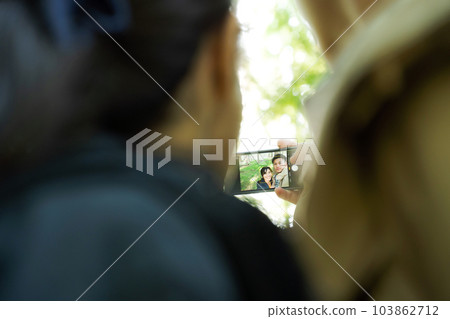 photo of man and woman taking a selfie photo of man and woman taking a selfie 103862712