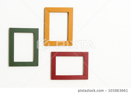 empty picture frame on white wall background 103863661